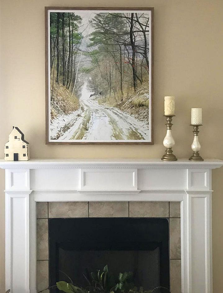 Cottontail Run by Glen Loates above a collector's mantel