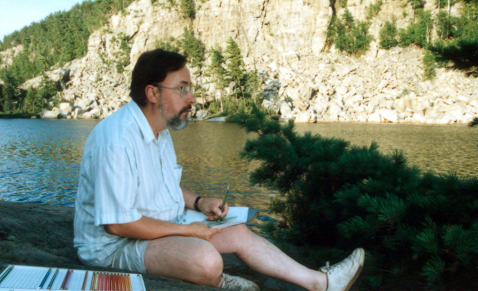 Glen Loates sketching in Temagami Ontario 1985